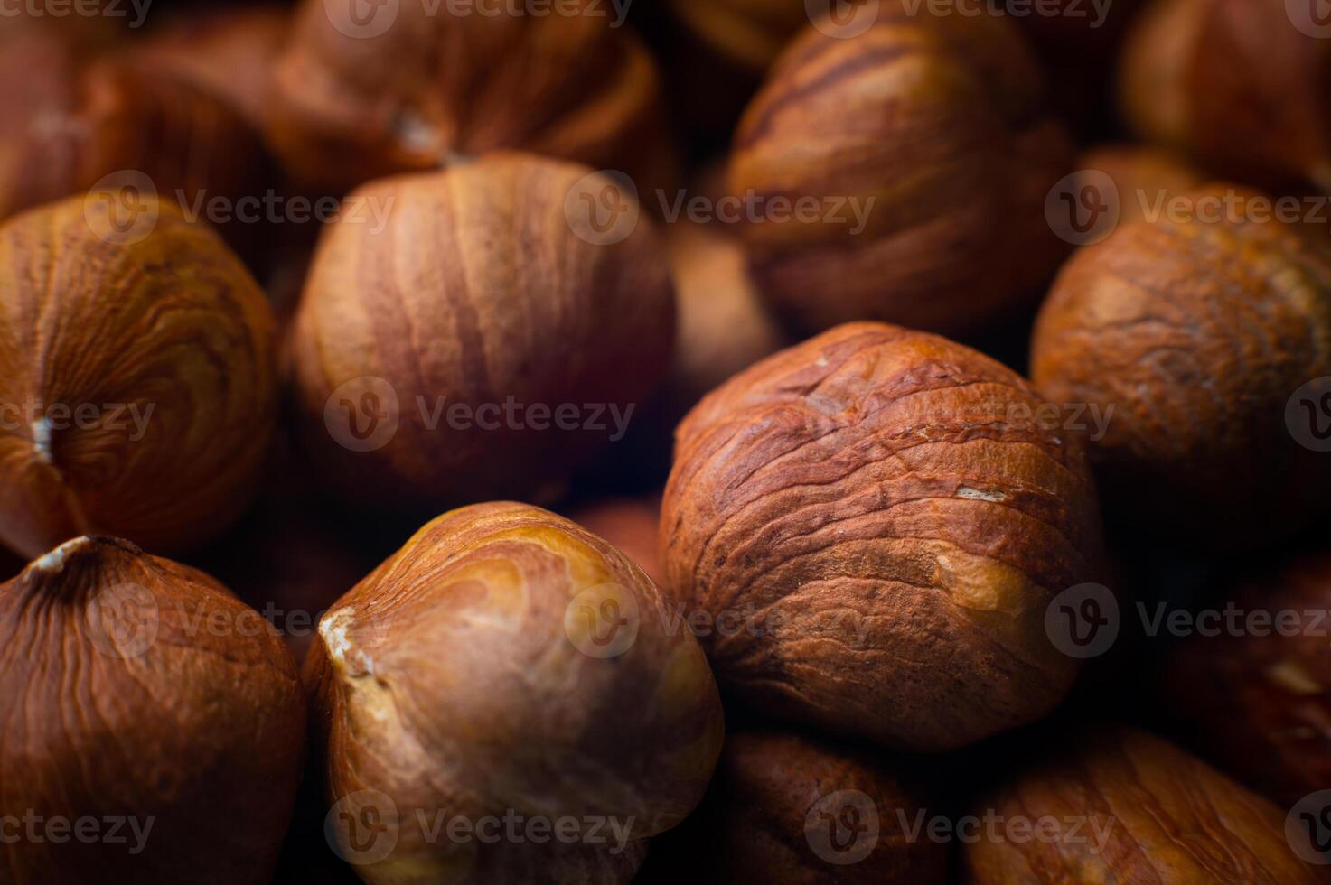 hazelnut kernels close-up. macro shot of the texture of a pile of nuts photo