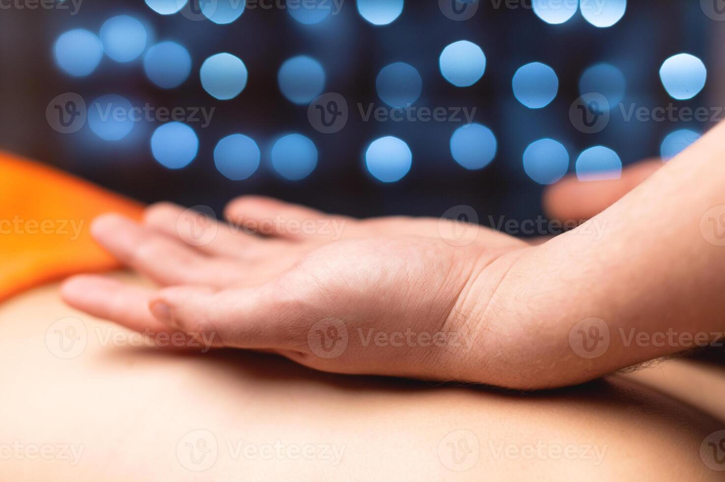 Back rub massage in a professional office in shallow depth of field. photo