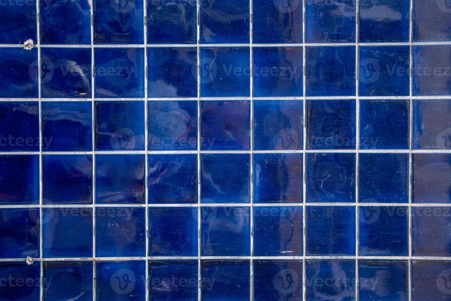 dark blue tile wall, abstract pattern mosaic background, textured wall or floor photo