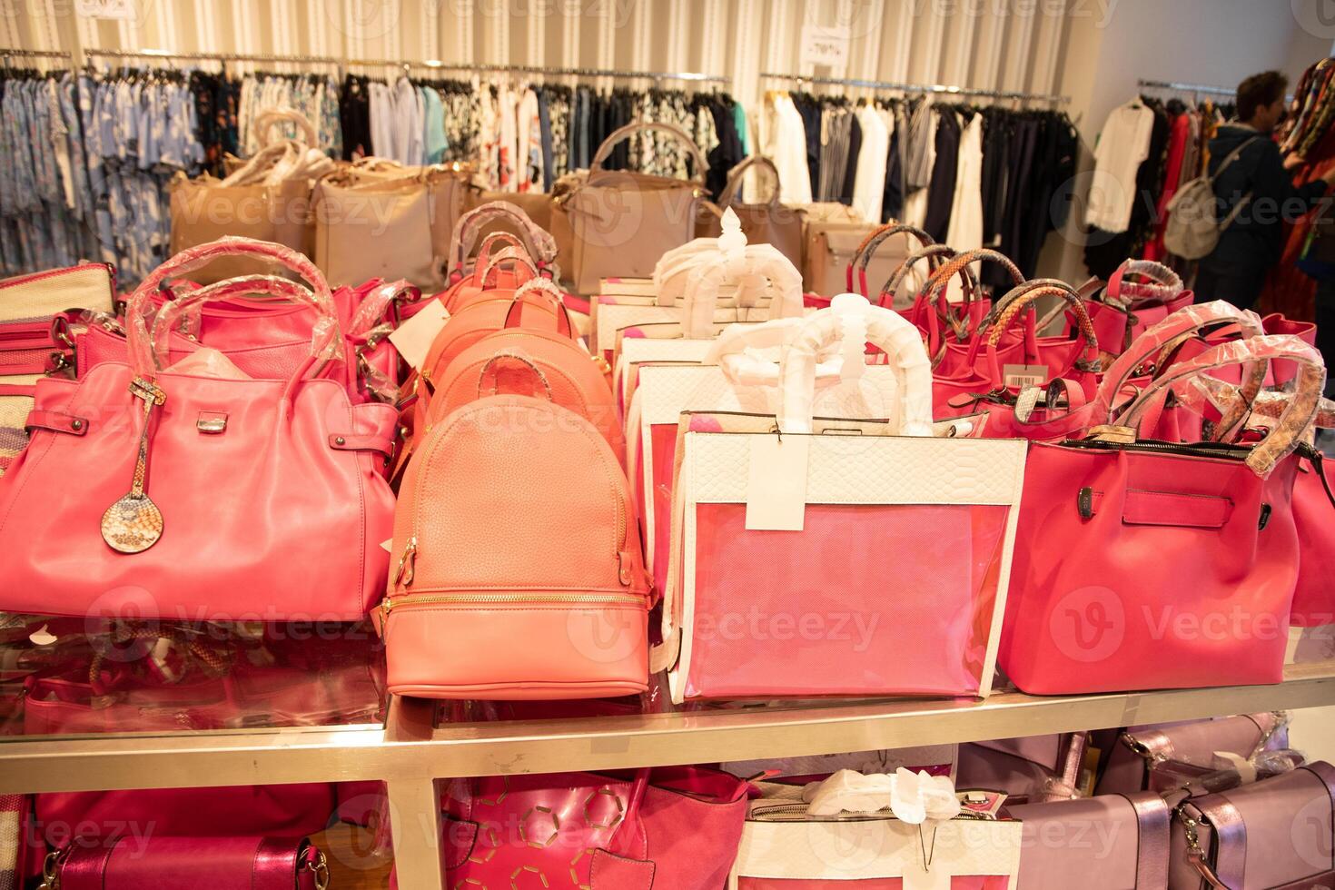variety bag collection in store on counter pink magenta trendy pantone color photo
