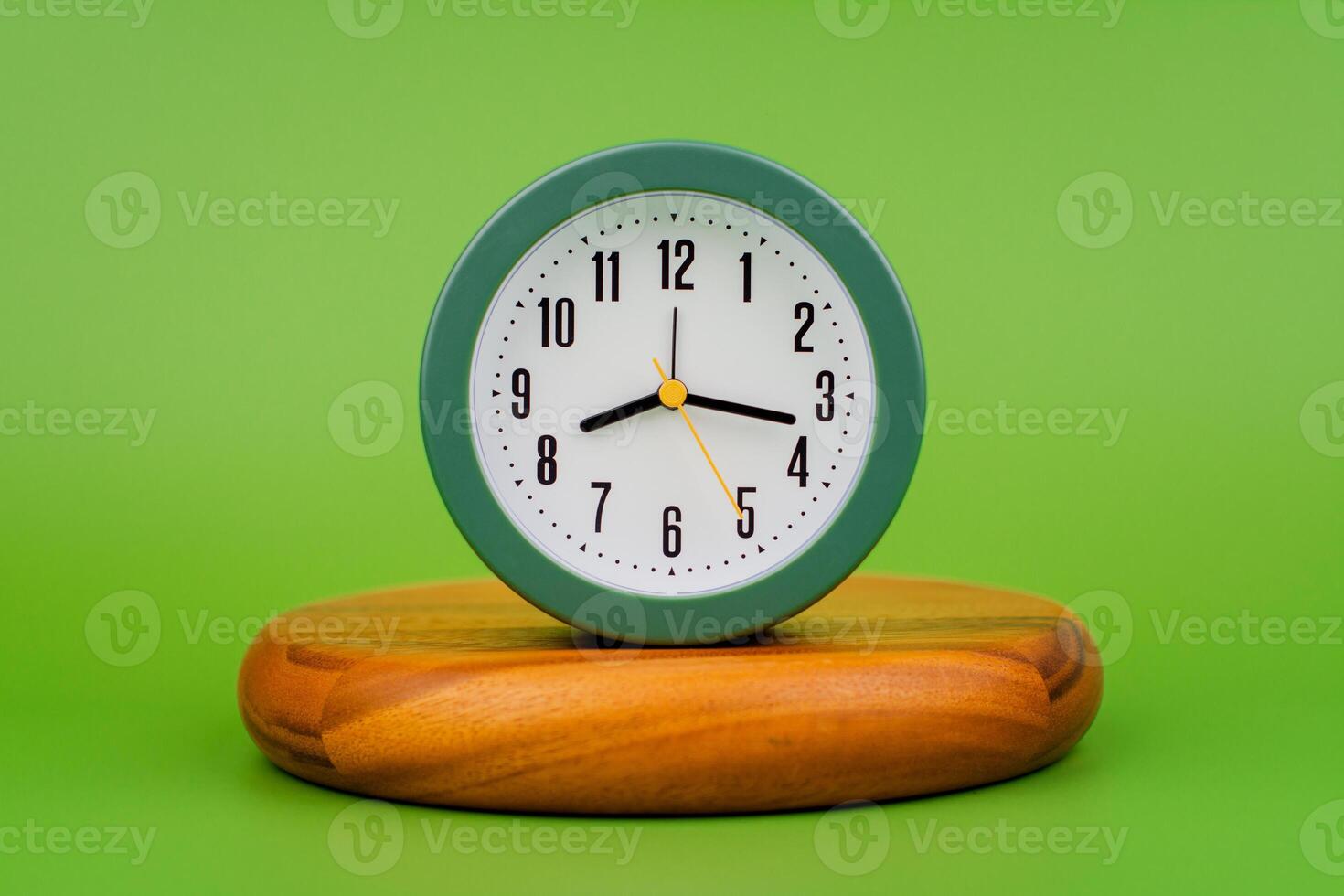 Modern alarm clock ticking, standing still time, time concept, time photography in studio. photo