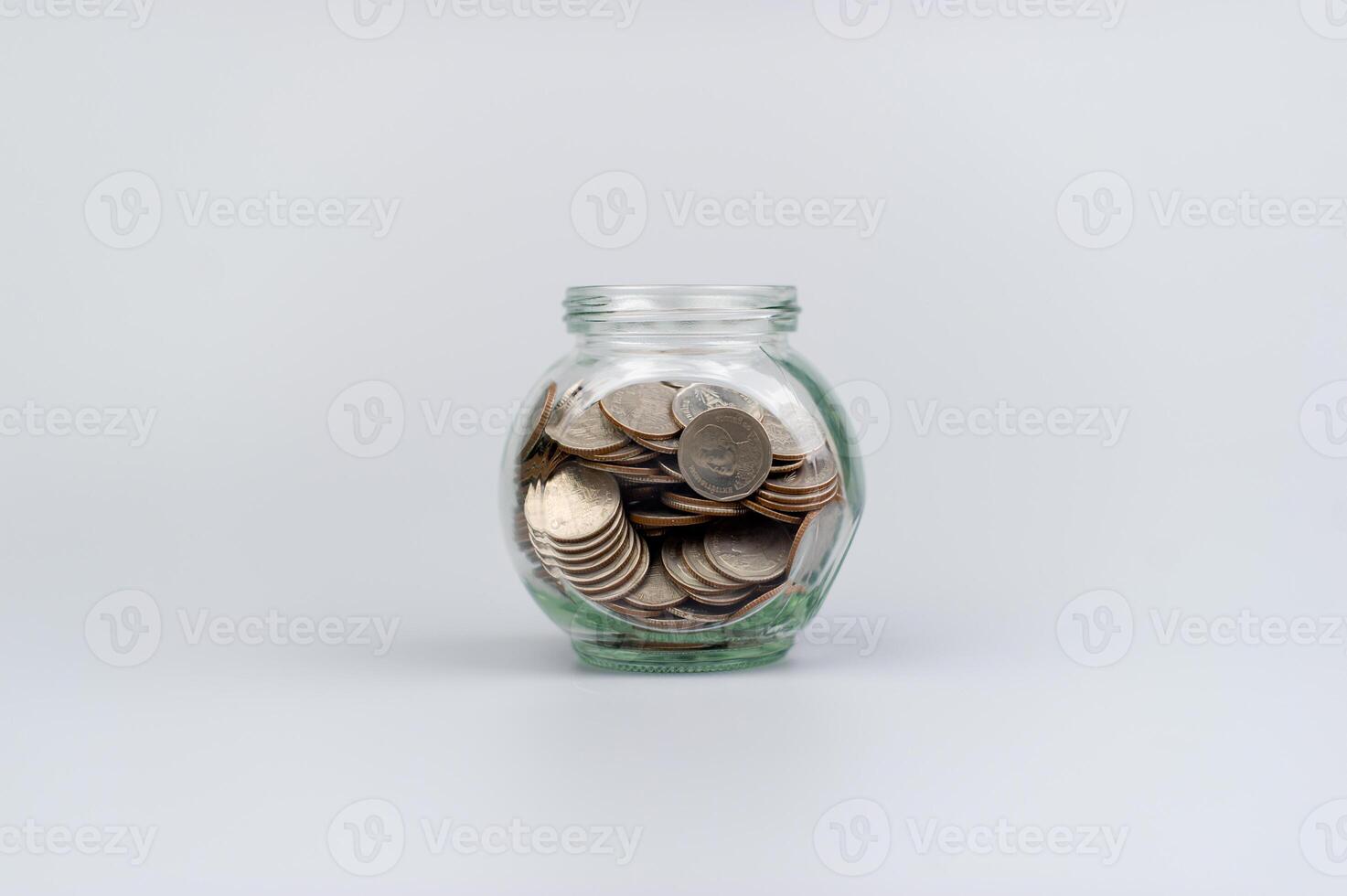 Money and time, savings, coins in a glass jar, financial planning financial investment Income, cash flow and living expenses photo