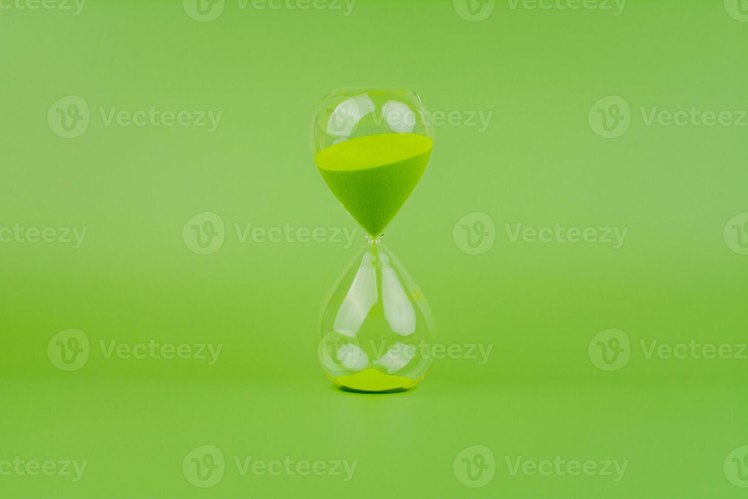 Hourglass, colorful countdown, time limit, time concept and importance of spending time. photo