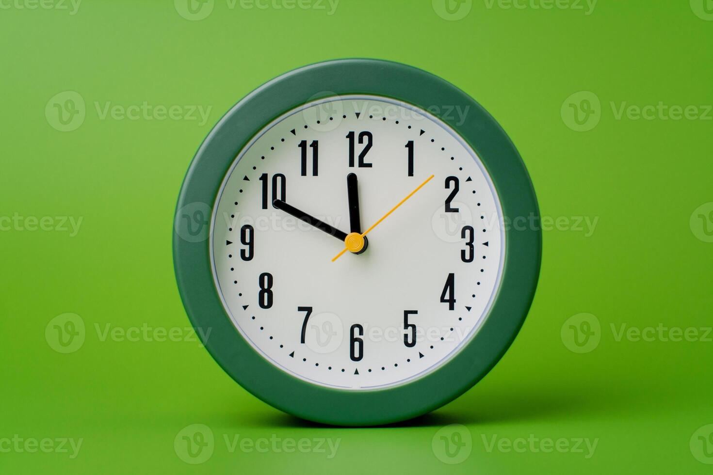 Modern alarm clock ticking, standing still time, time concept, time photography in studio. photo