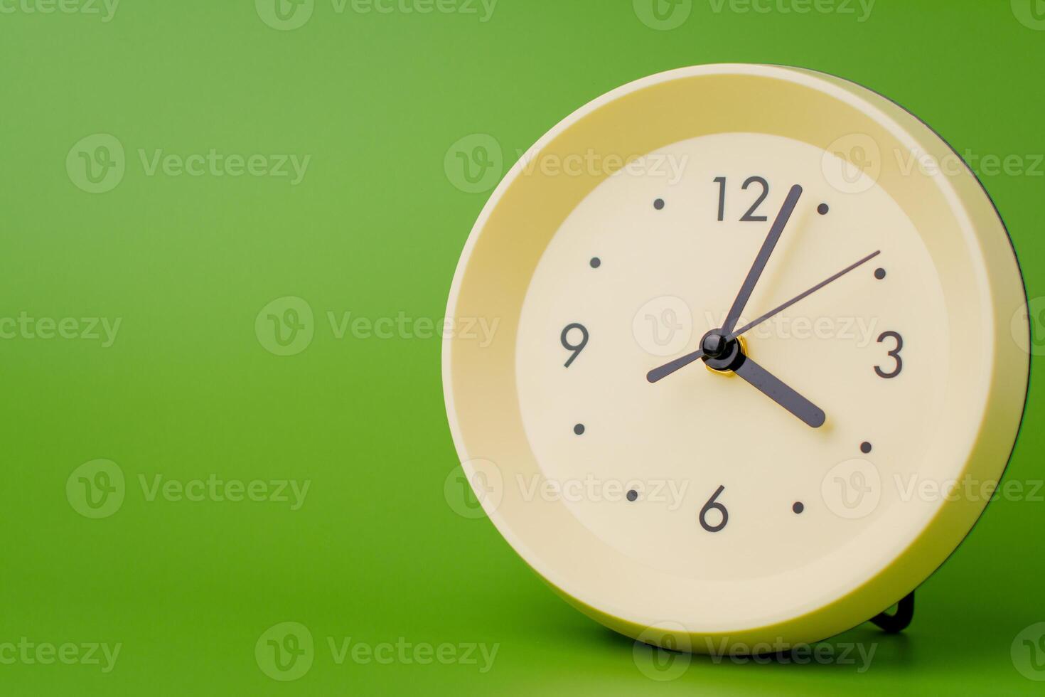 Modern alarm clock ticking, standing still time, time concept, time photography in studio. photo