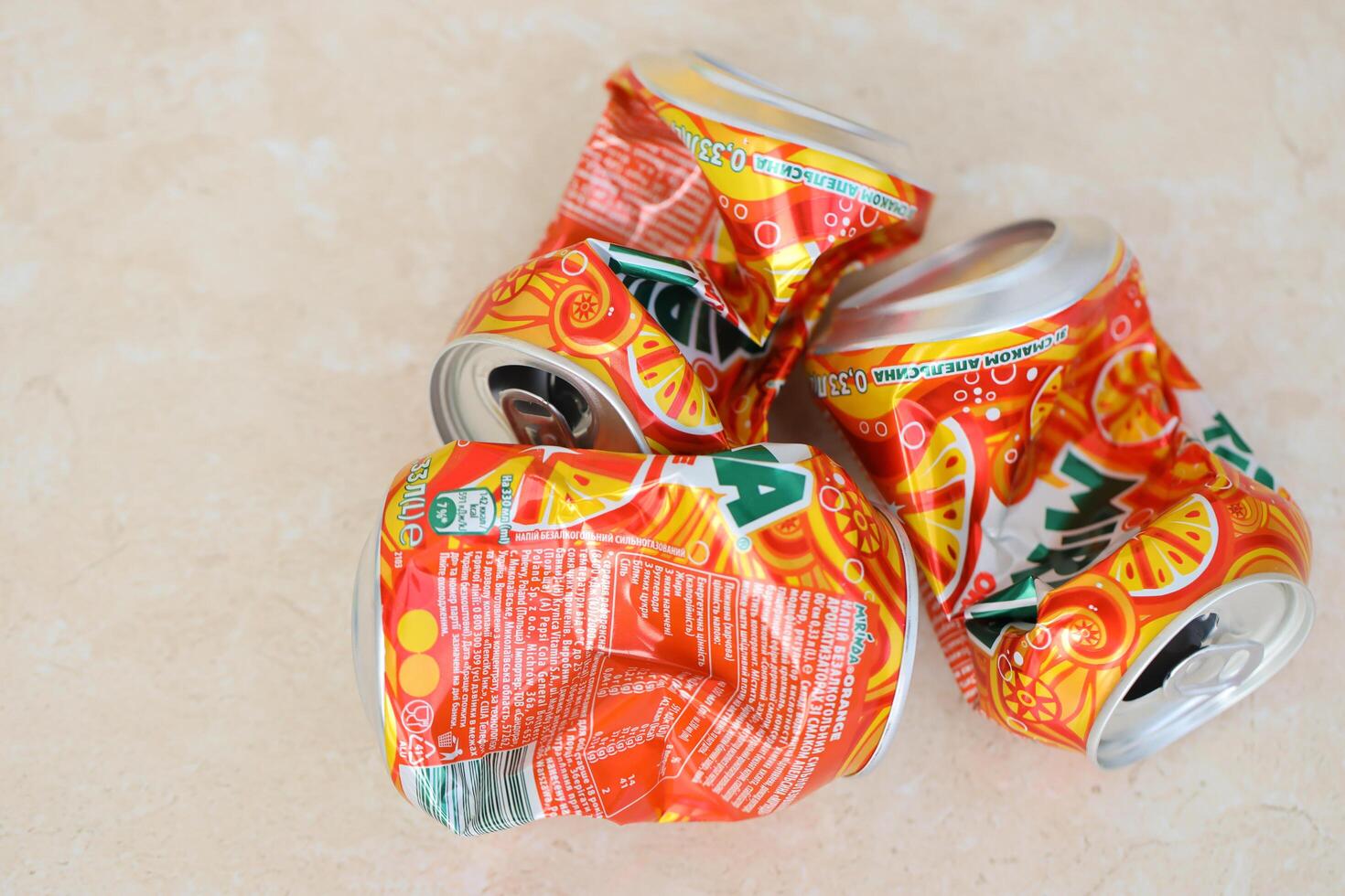 KYIV, UKRAINE - 4 MAY, 2023 Mirinda orange drink in orange citrus tin can with classic design and logo photo