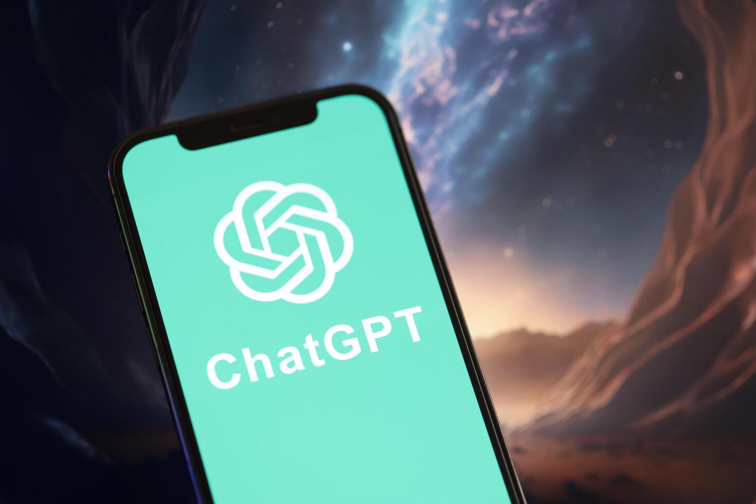 KYIV, UKRAINE - MARCH 17, 2024 ChatGPT logo on iPhone display screen with background of artificial intelligence futuristic image photo