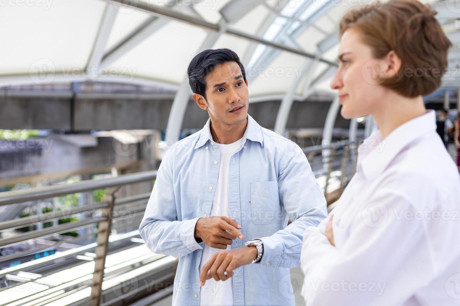 Couple from different background and culture having difficulties in relationship with punctual and time management that create conflict and misunderstanding in marriage photo