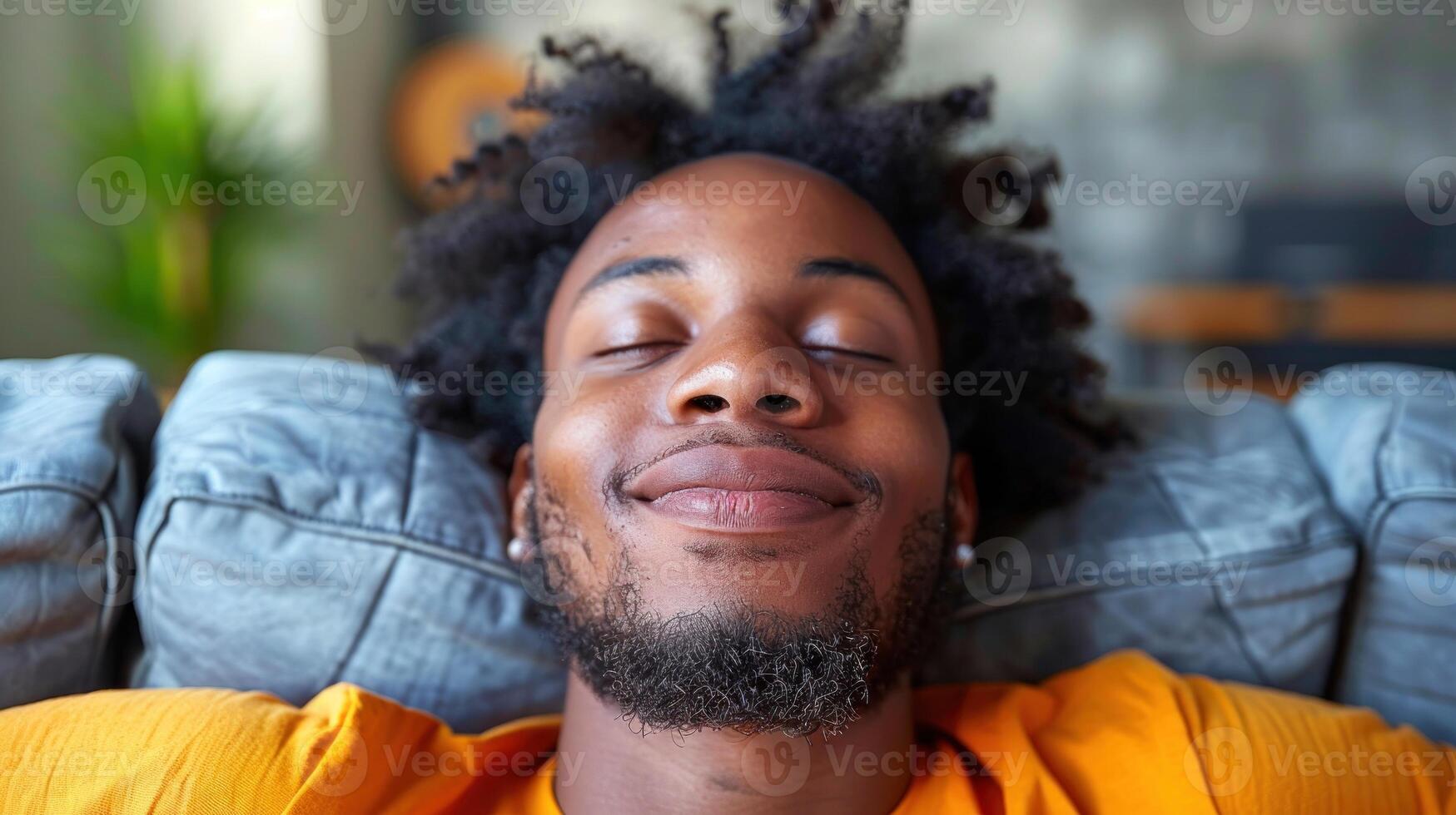 Close up of a person laying on a couch photo