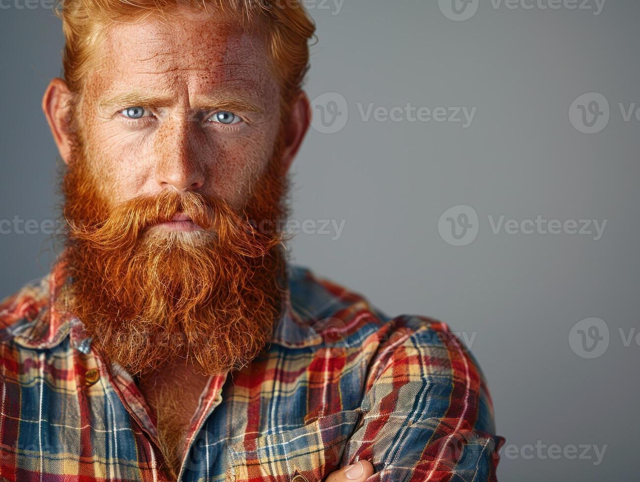 Red-bearded man with striking blue eyes photo