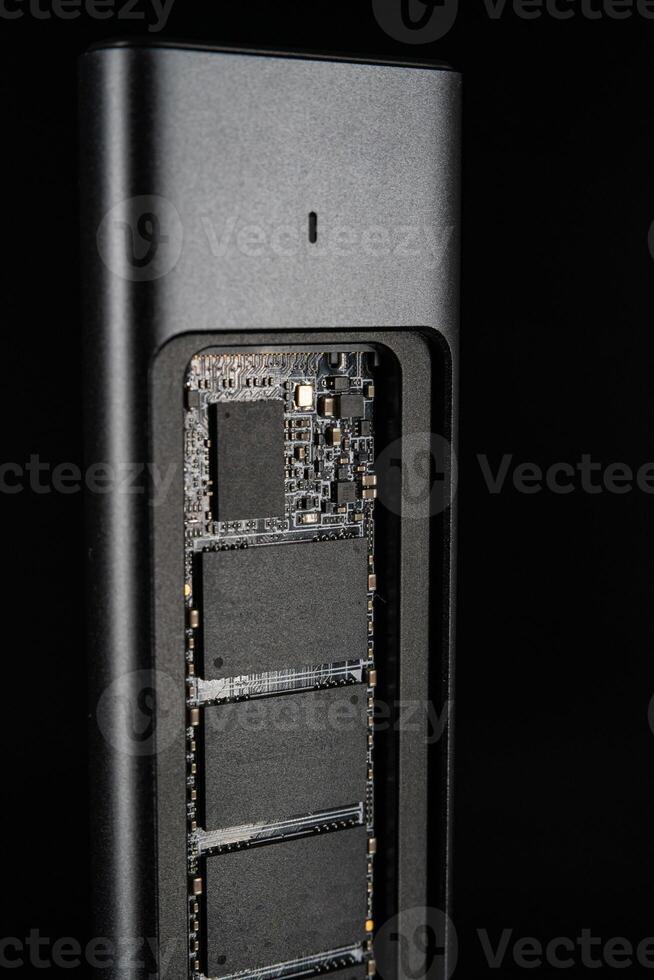Open SSD Case with inside High-Speed M.2 on black background, External USB Drive photo