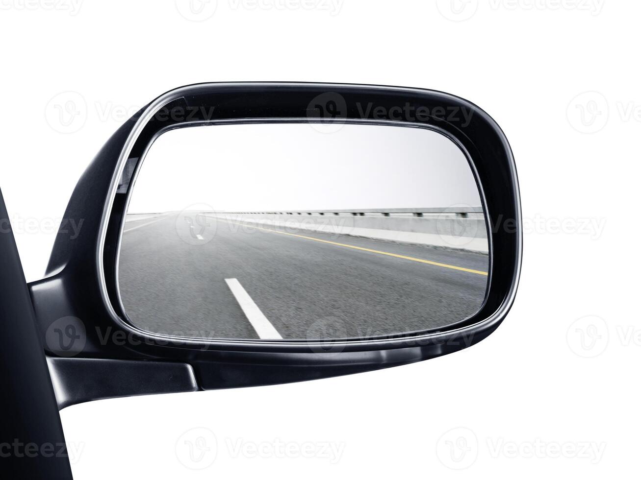 A rear view mirror with a picture of the road in it photo