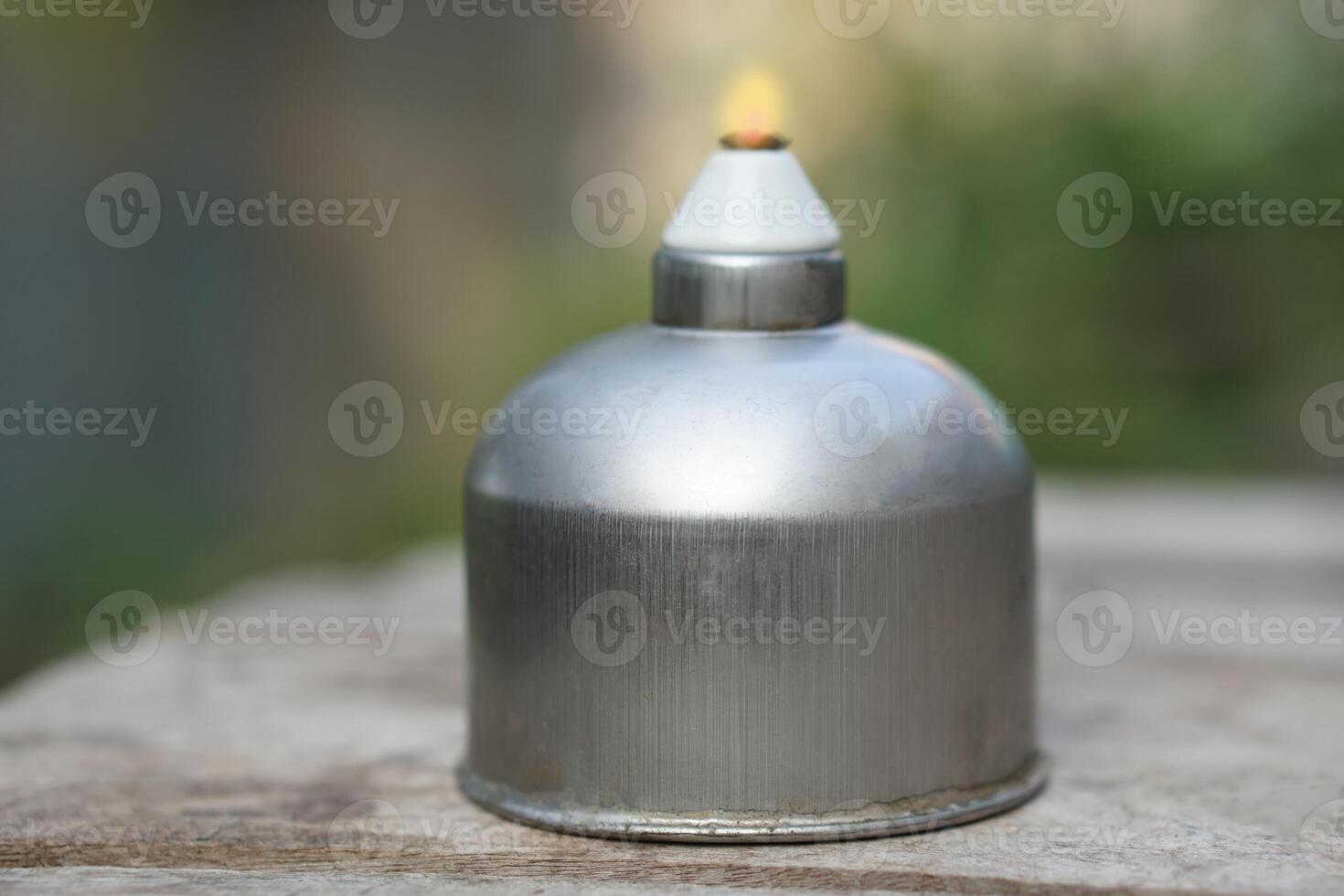 Stainless steel alcohol burner lantern. Laboratory lamp. Concept, equipment or tool for science experiment. Educational toolkit in science subject. photo