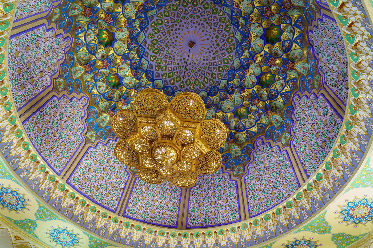 Geometric traditional Islamic ornament and domed ceiling chandelier. Fragment of a ceramic mosaic. photo