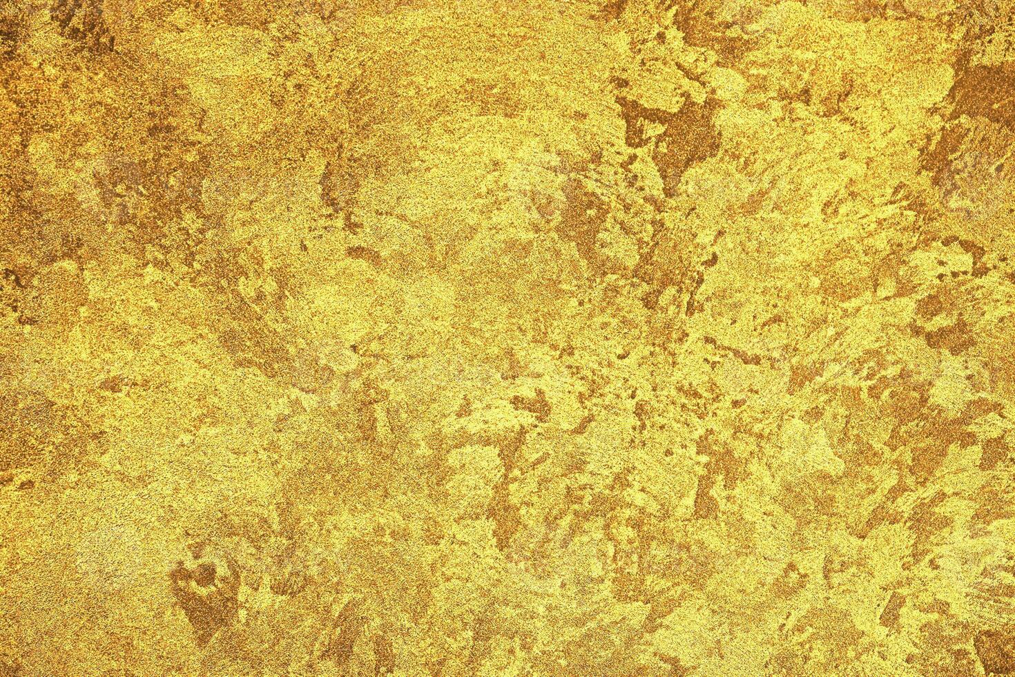 Texture of golden decorative plaster or concrete. Abstract gold grunge background. photo