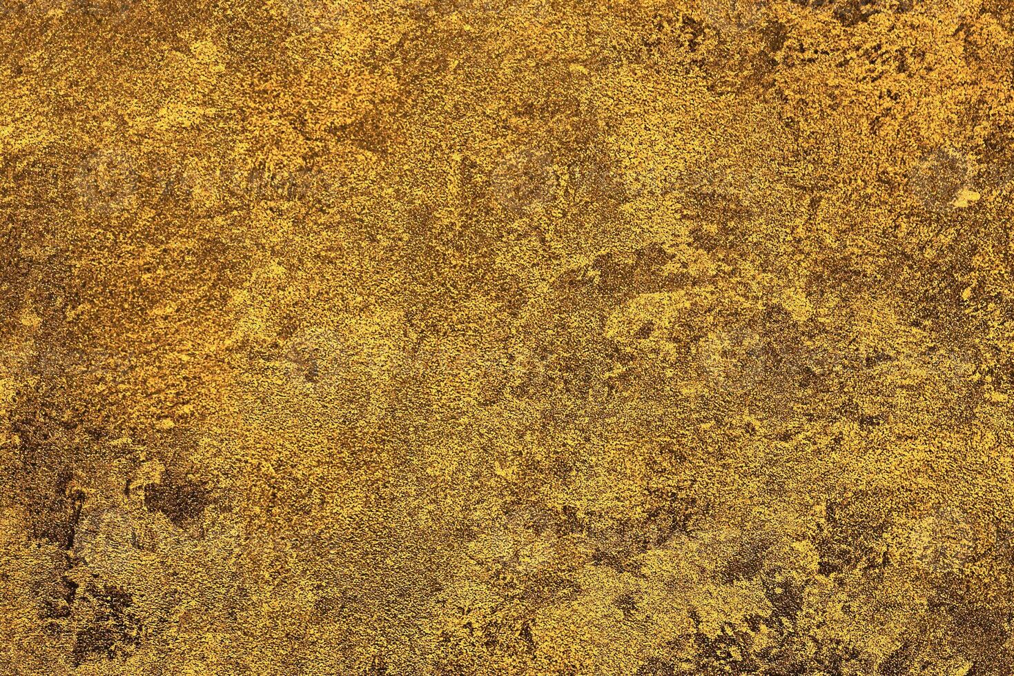 Texture of golden decorative plaster or concrete. Abstract gold grunge background. photo