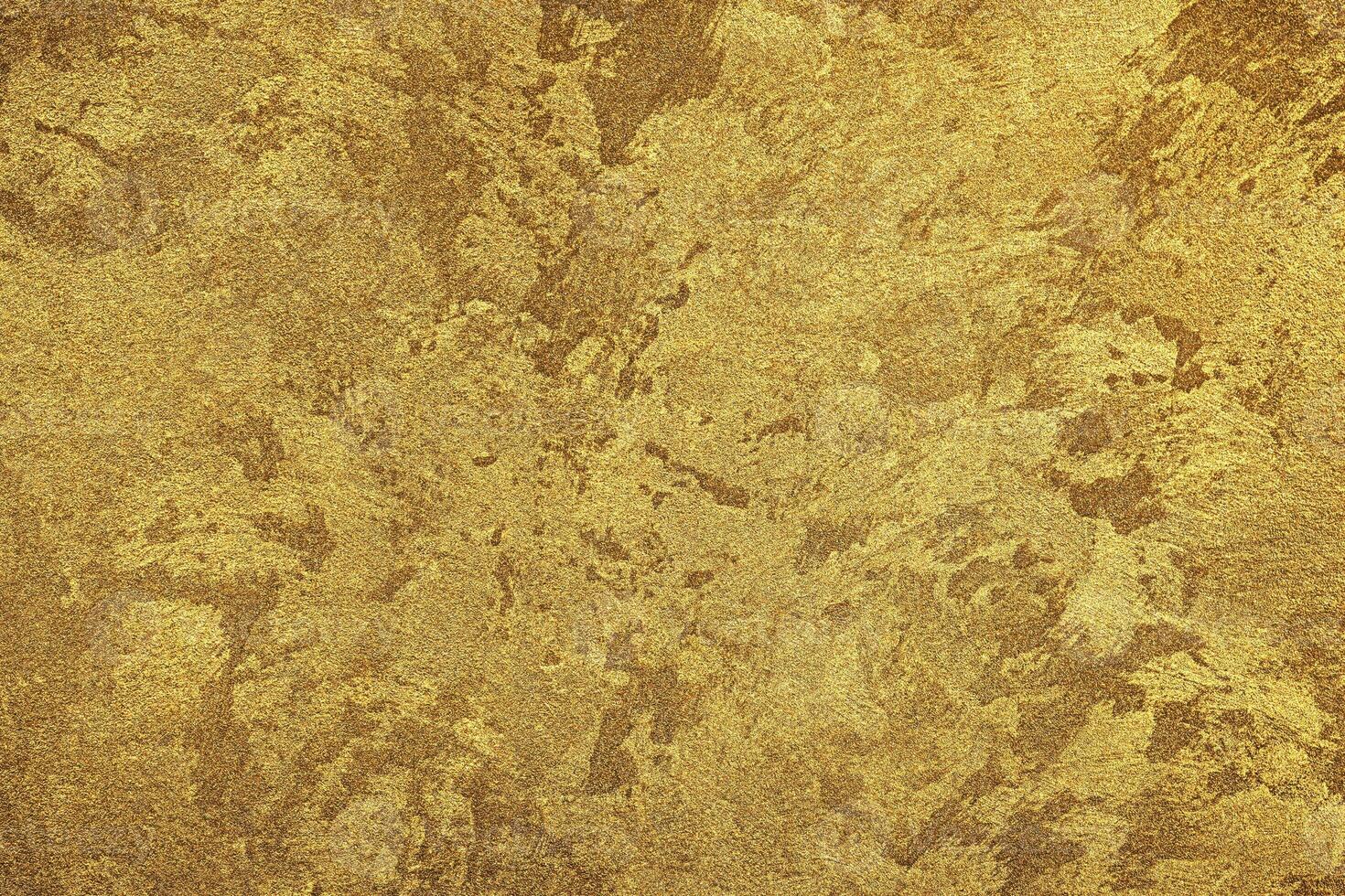 Texture of golden decorative plaster or concrete. Abstract gold grunge background. photo