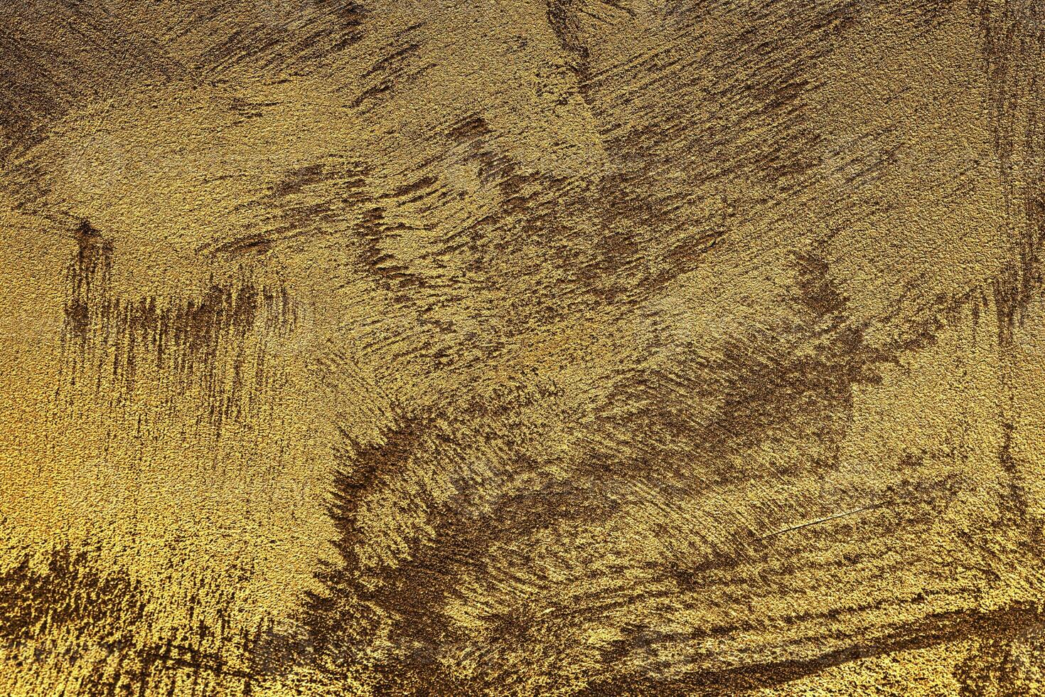 Texture of golden decorative plaster or concrete. Abstract gold grunge background. photo