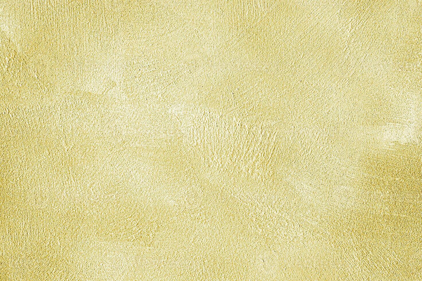 Texture of golden decorative plaster or concrete. Abstract gold grunge background. photo