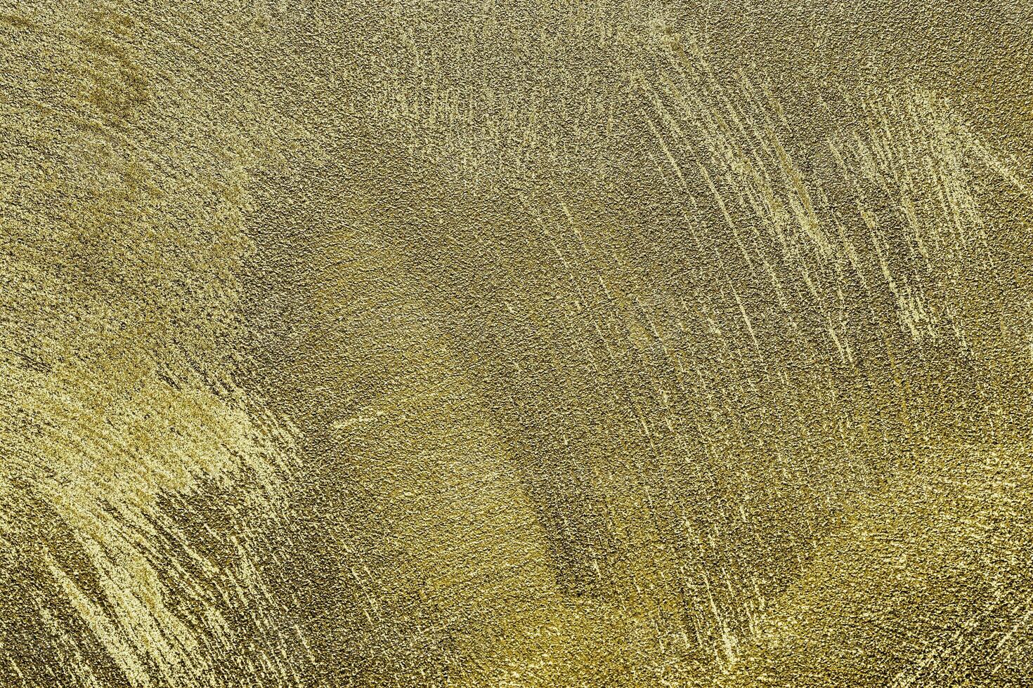 Texture of golden decorative plaster or concrete. Abstract gold grunge background. photo