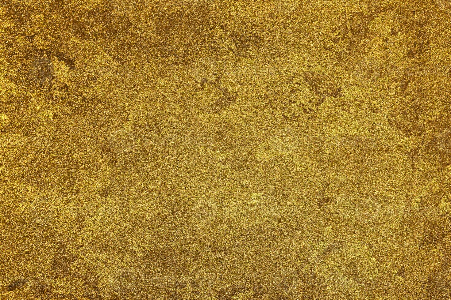 Texture of golden decorative plaster or concrete. Abstract gold grunge background. photo
