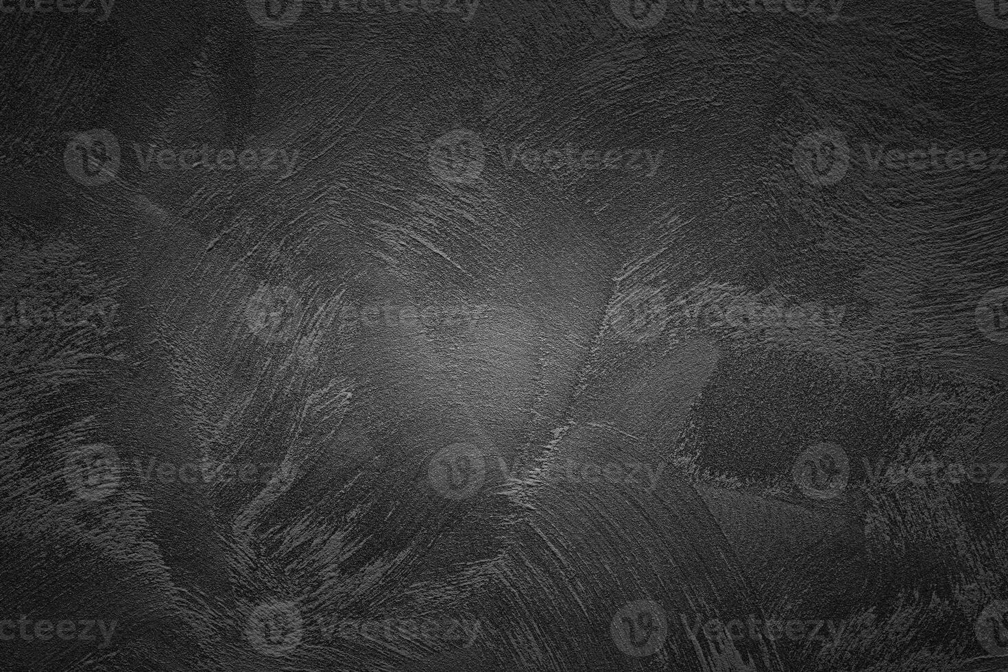 Texture of black decorative plaster or concrete with vignette. Abstract grunge background. photo