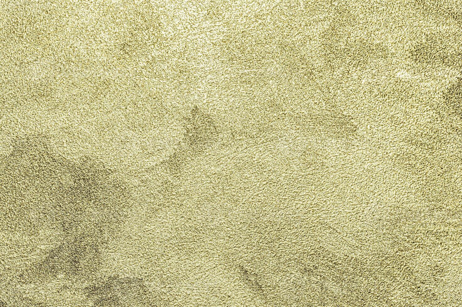 Texture of golden decorative plaster or concrete. Abstract gold grunge background. photo