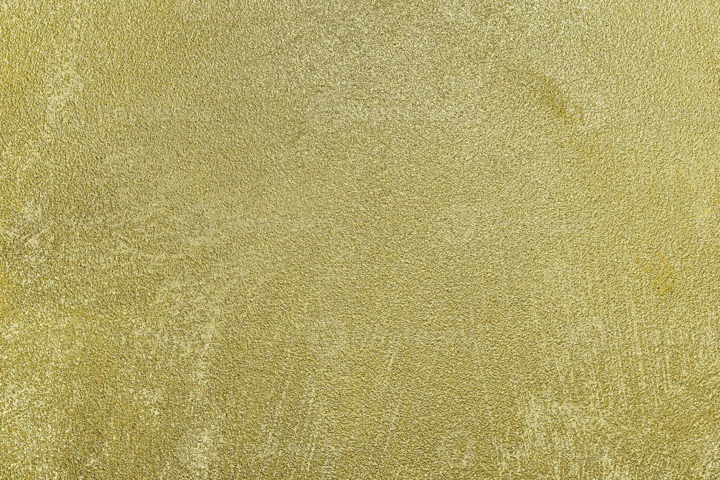 Texture of golden decorative plaster or concrete. Abstract gold grunge background. photo
