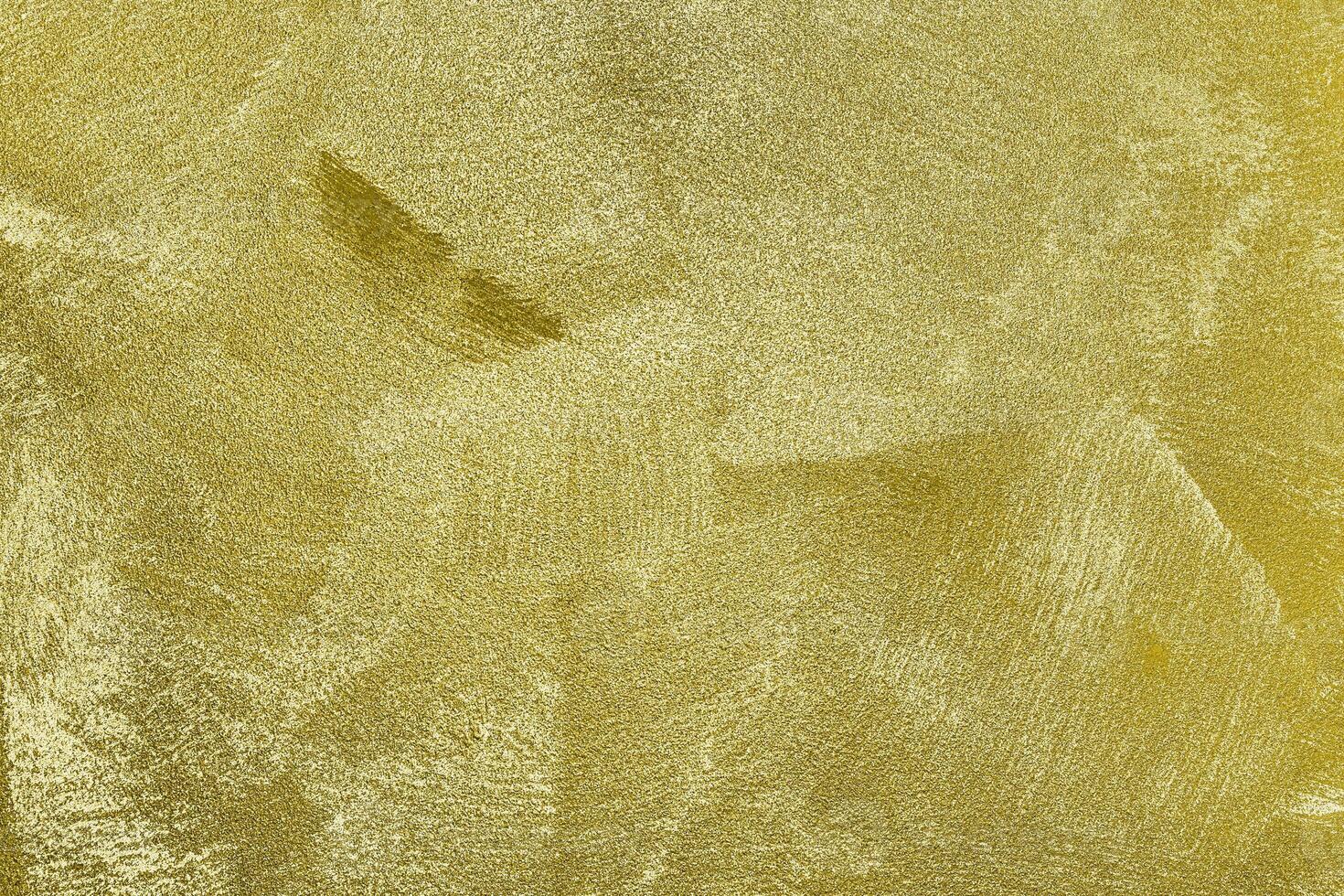 Texture of golden decorative plaster or concrete. Abstract gold grunge background. photo