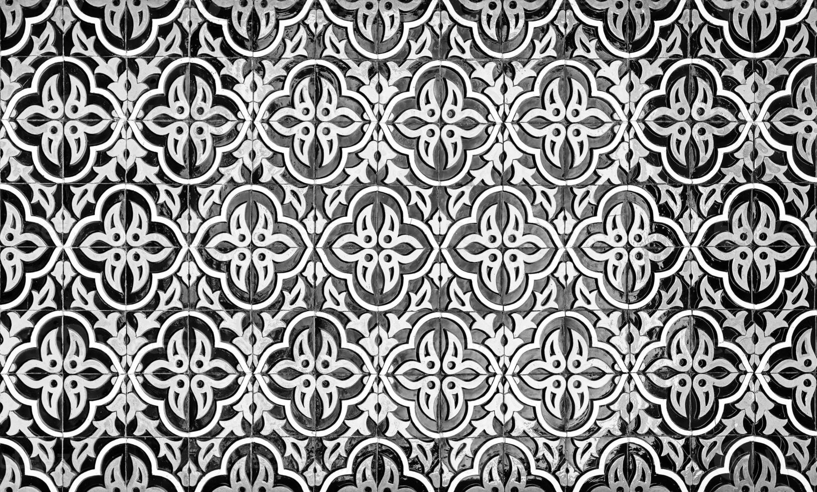 Geometric traditional Islamic ornament. Fragment of a ceramic mosaic. Black and white. photo