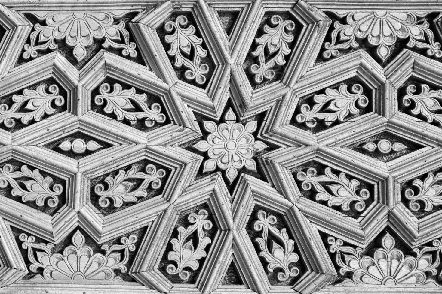 Geometric traditional Islamic ornament. Fragment of a ceramic mosaic. Black and white. photo