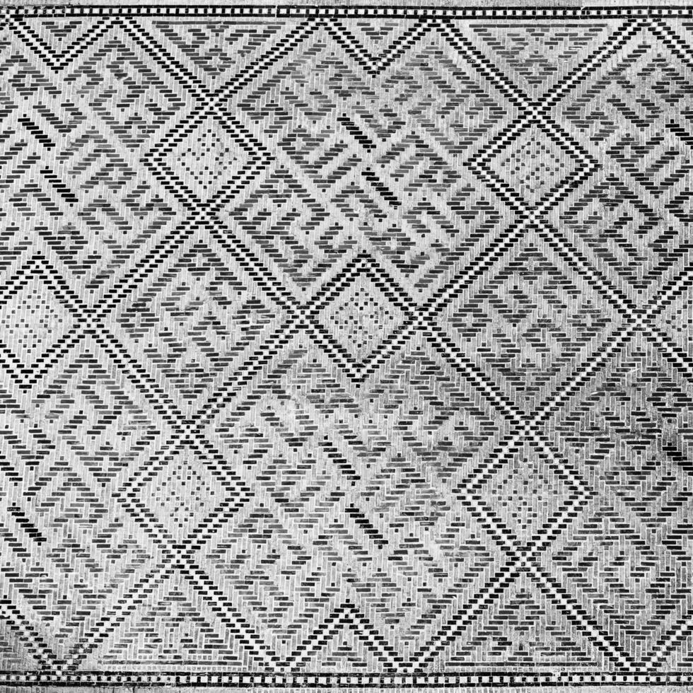 Geometric traditional Islamic ornament. Fragment of a ceramic mosaic. Black and white. photo