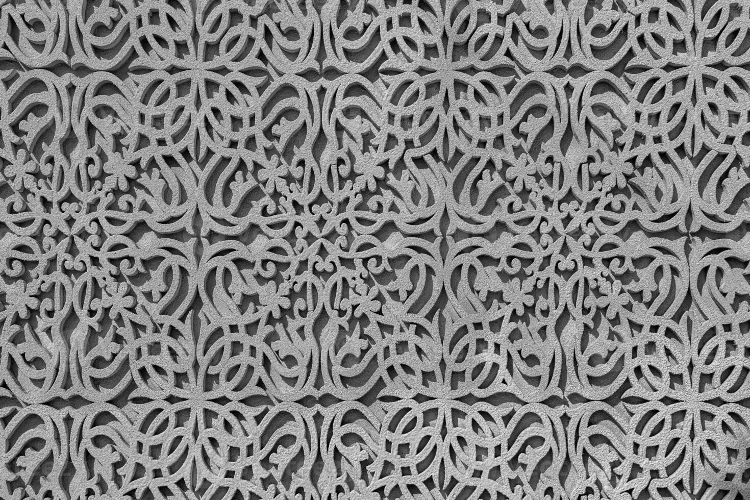 Geometric traditional Islamic ornament. Fragment of a concrete mosaic. Black and white. photo