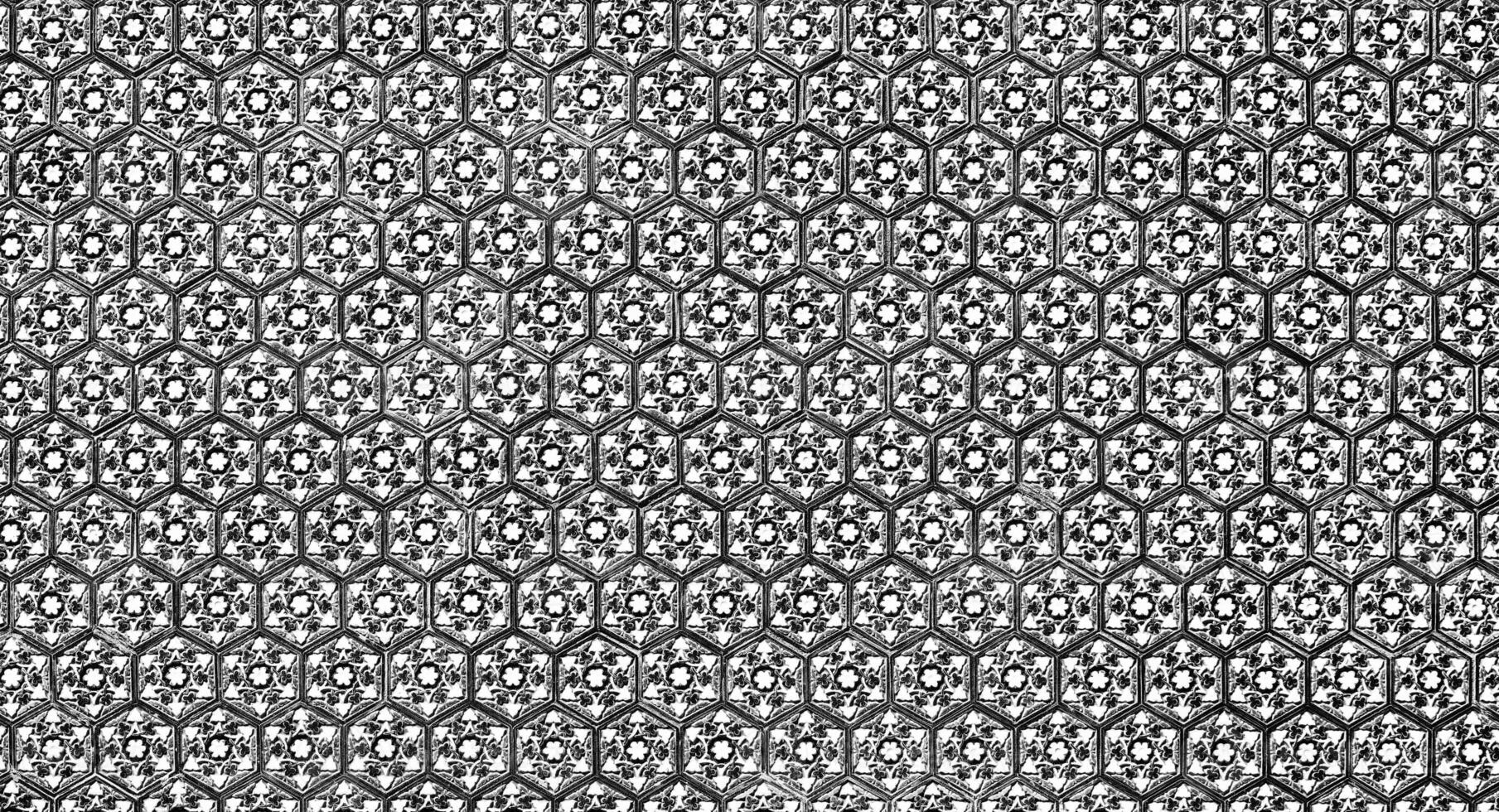 Geometric traditional Islamic ornament. Fragment of a ceramic mosaic. Black and white. photo