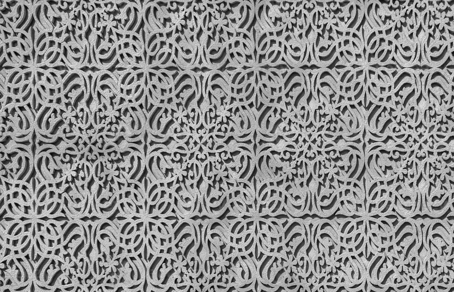 Geometric traditional Islamic ornament. Fragment of a concrete mosaic. Black and white. photo