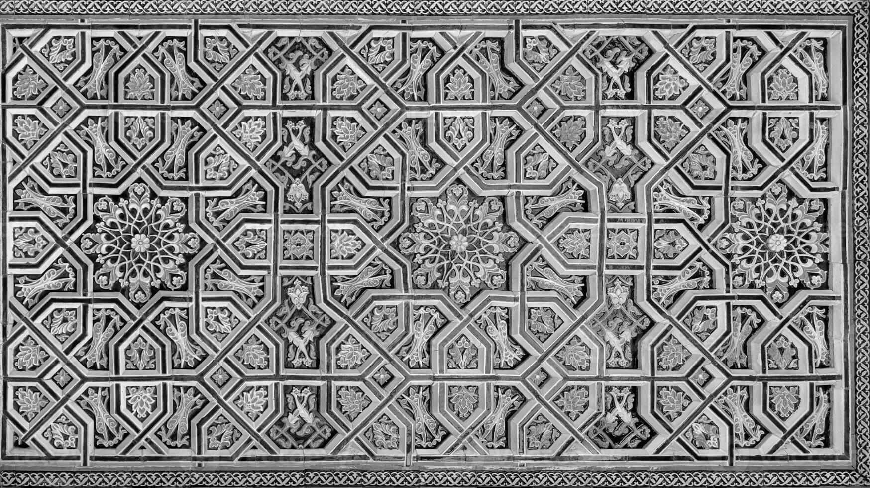 Geometric traditional Islamic ornament. Fragment of a ceramic mosaic. Black and white. photo