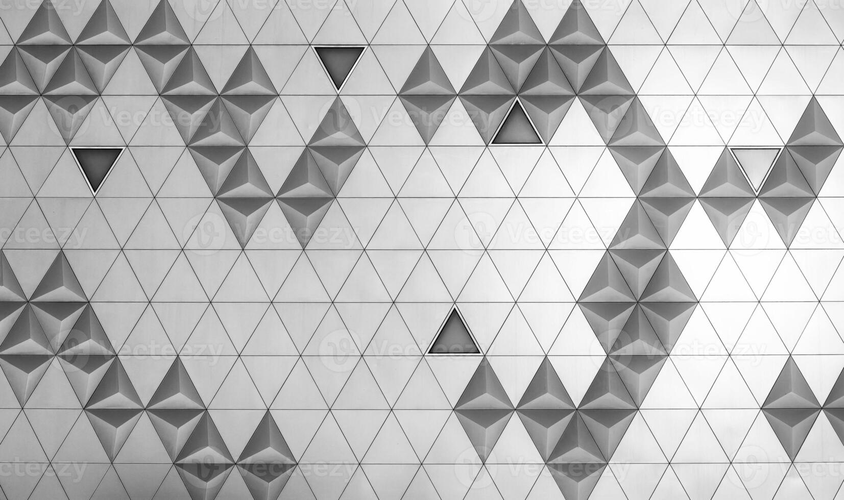 acero en forma de diamante pulido metal revestimiento paneles de un moderno edificio. resumen monocromo antecedentes. foto