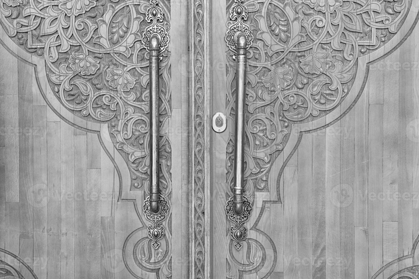 Black and white Carved wooden doors with patterns and mosaics. photo