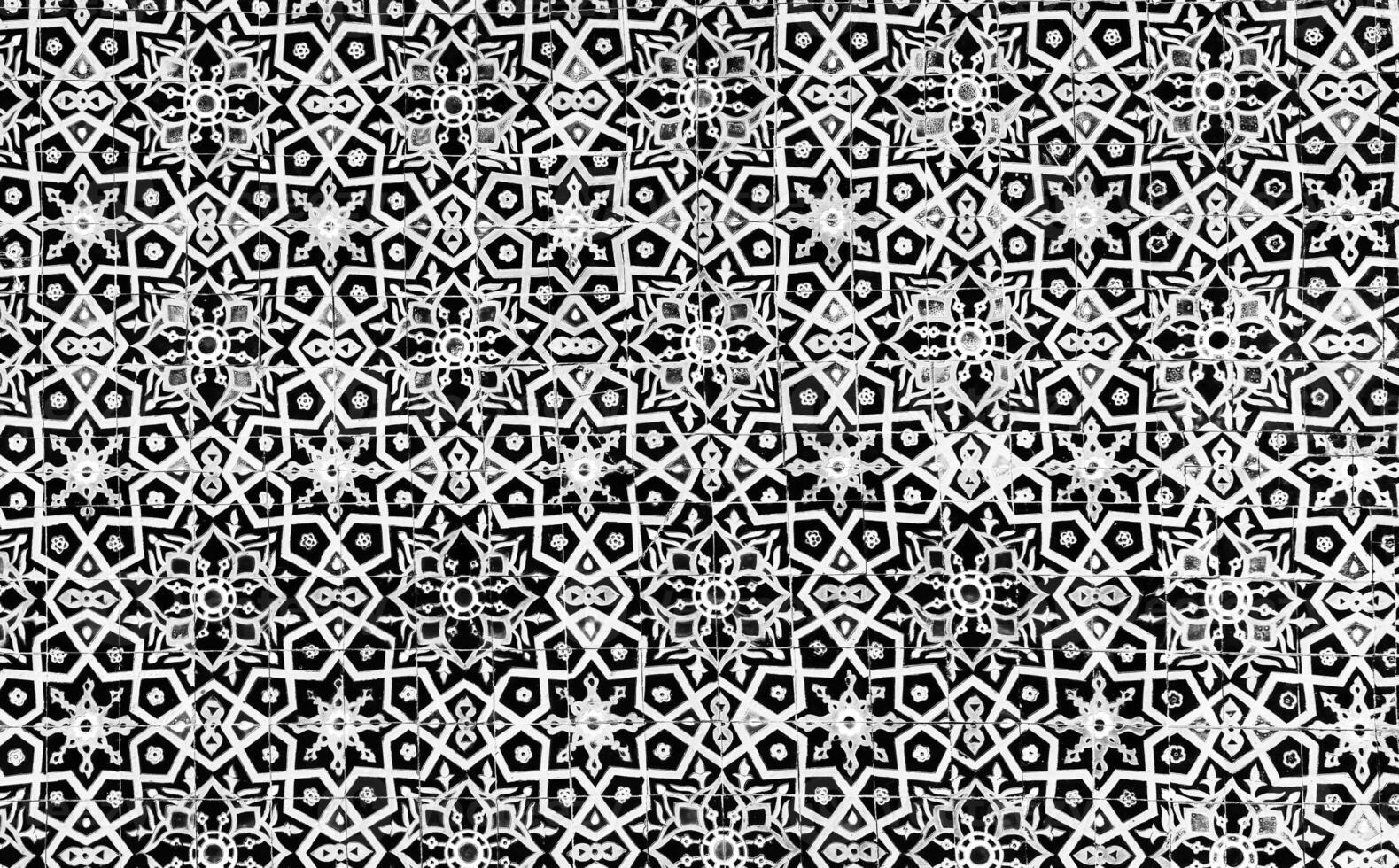 Geometric traditional Islamic ornament. Fragment of a ceramic mosaic. Black and white. photo