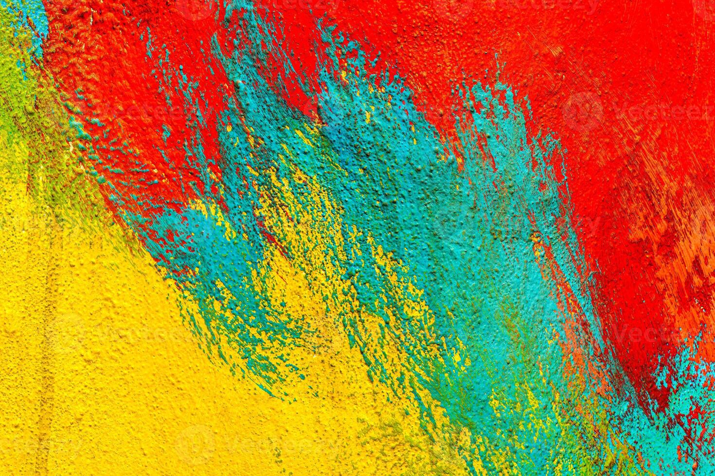 A fragment of colorful graffiti painted on a wall. Abstract urban background. Spray painting art. photo
