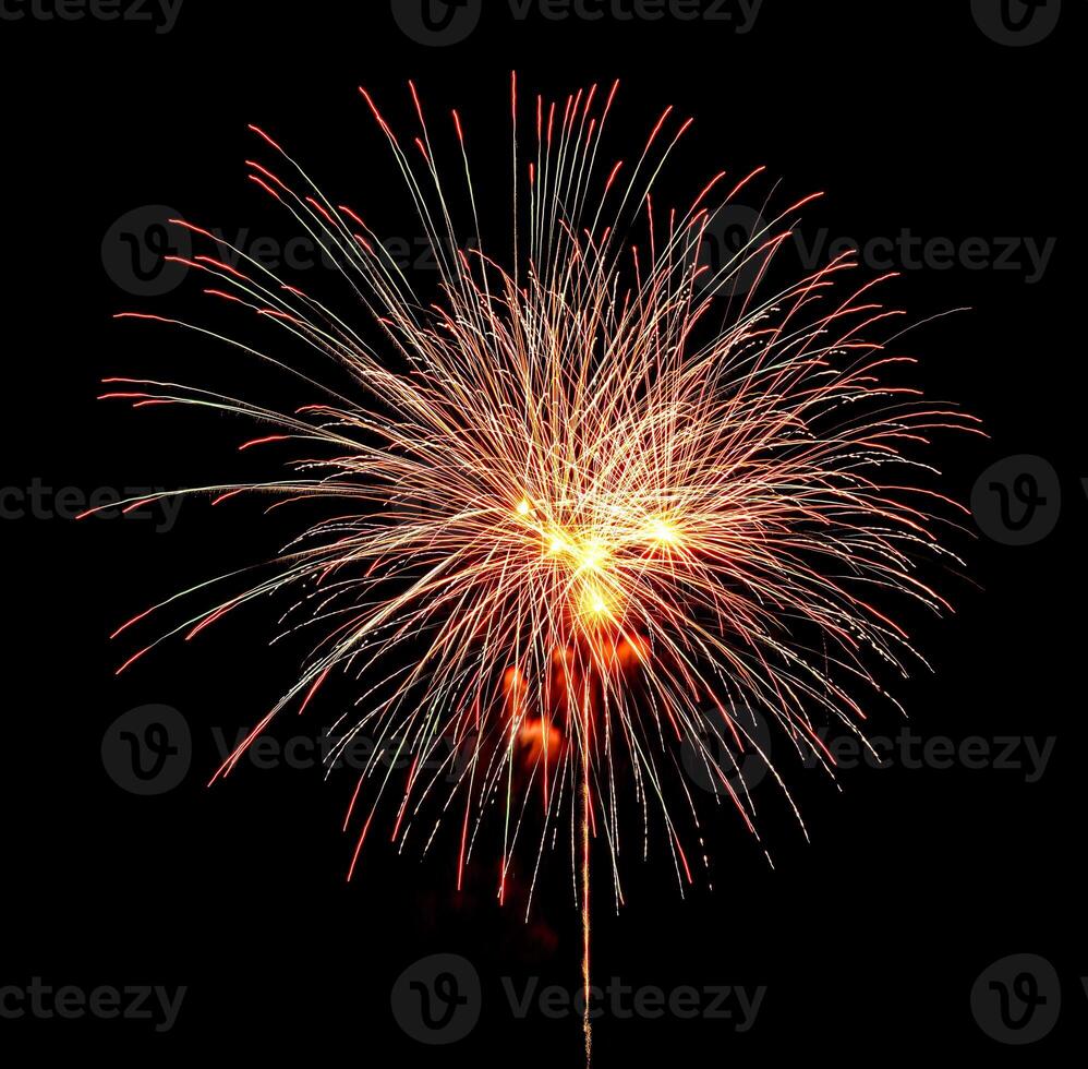 Colorful celebration fireworks isolated on a black sky background. photo