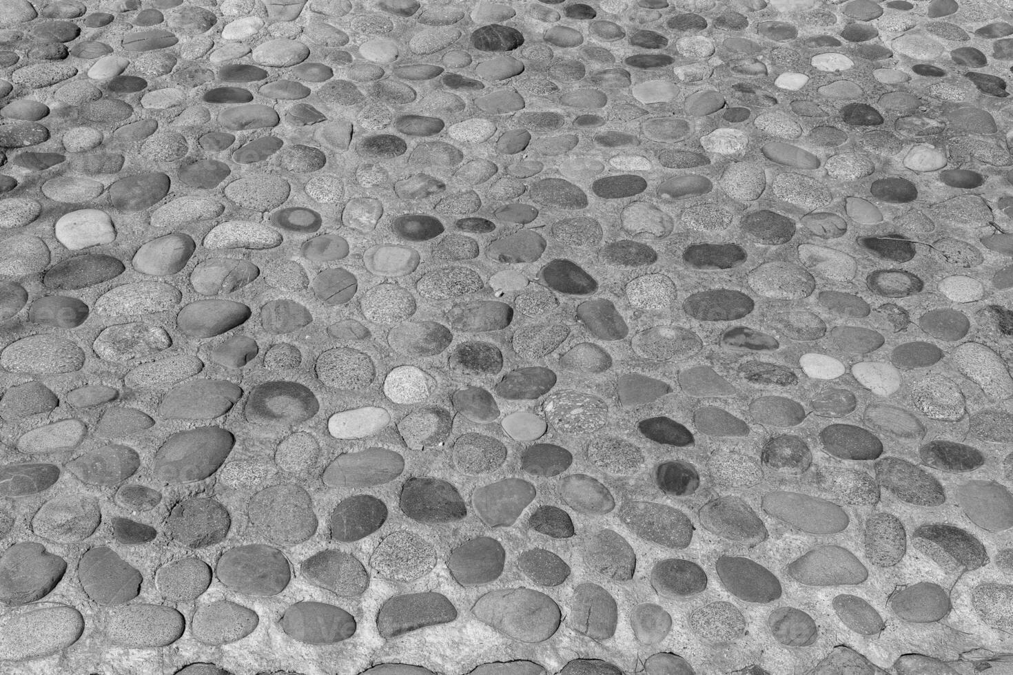 Old antique stone wall texture. Black and white. photo