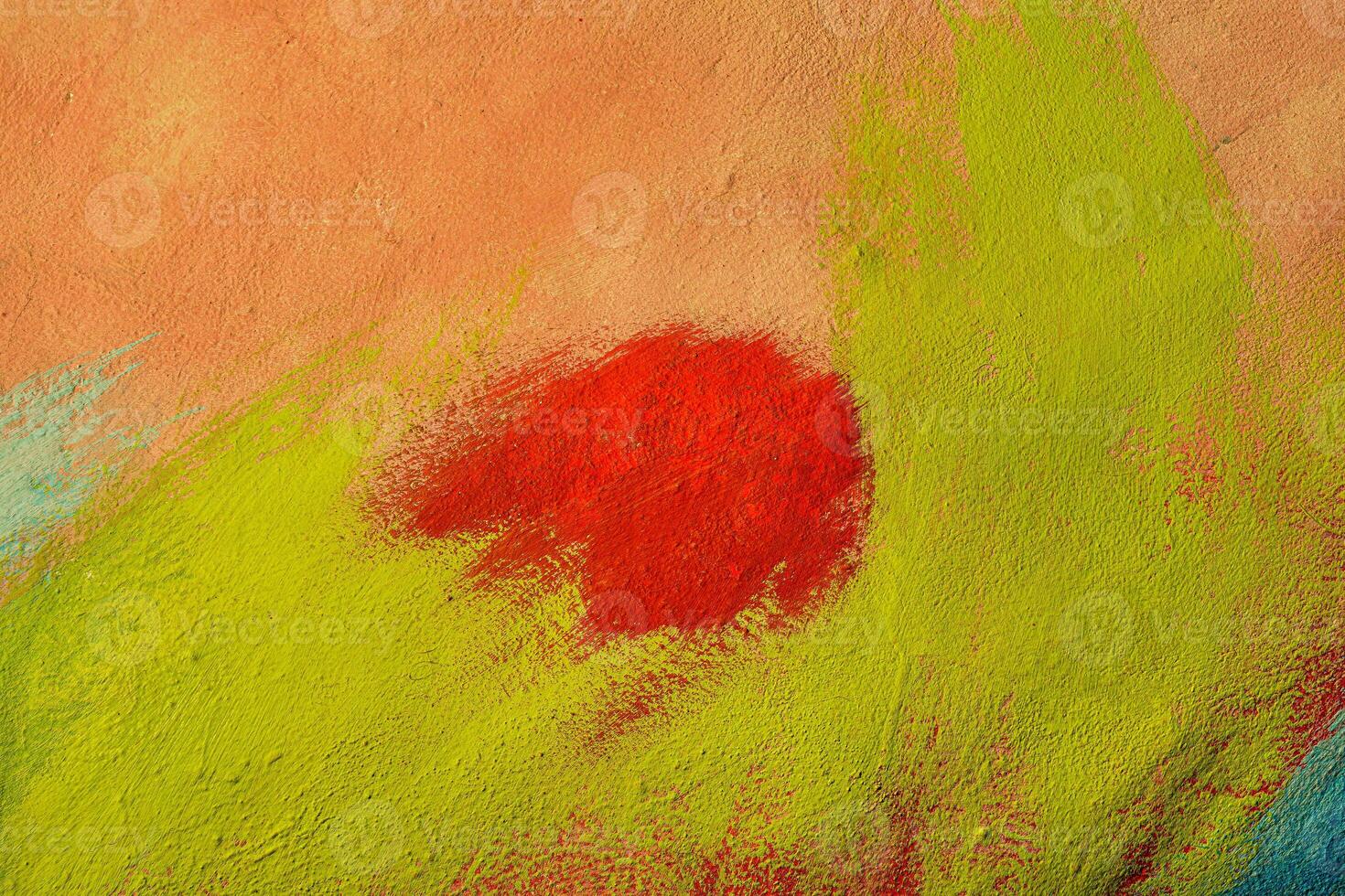 A fragment of colorful graffiti painted on a wall. Abstract urban background. Spray painting art. photo