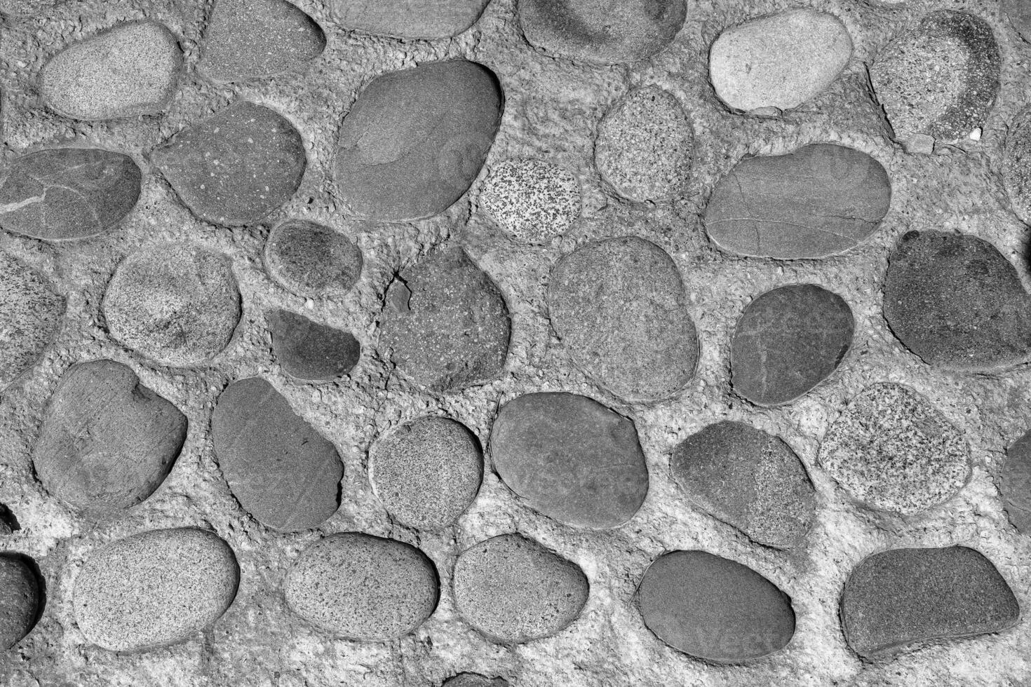 Old antique stone wall texture. Black and white. photo