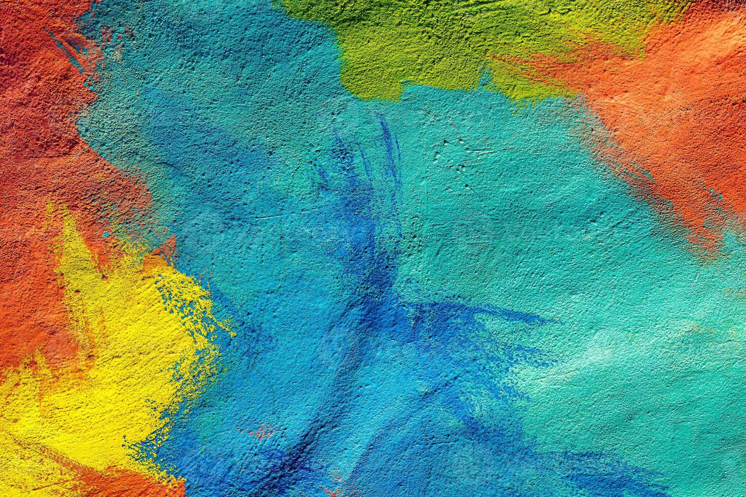 A fragment of colorful graffiti painted on a wall. Abstract urban background. Spray painting art. photo