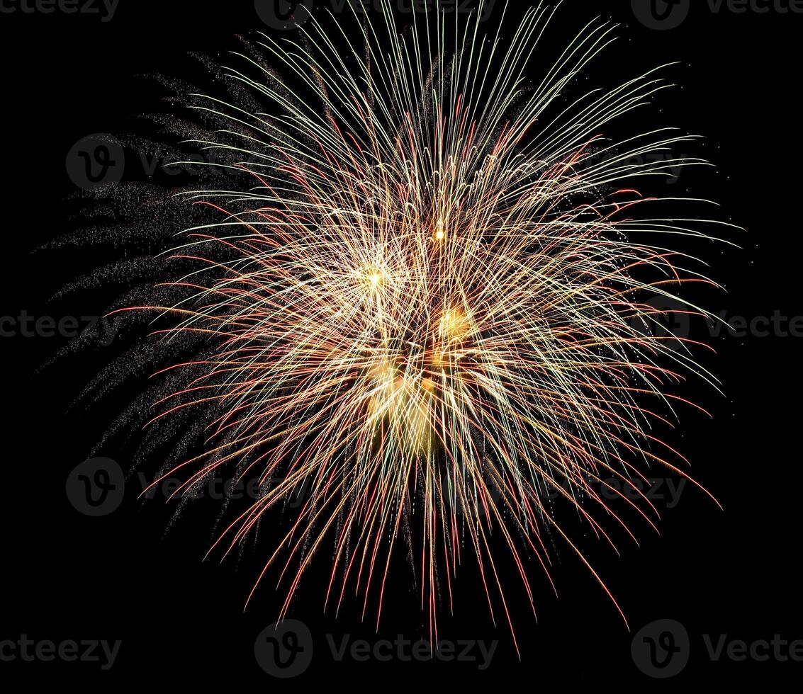 Colorful celebration fireworks isolated on a black sky background. photo