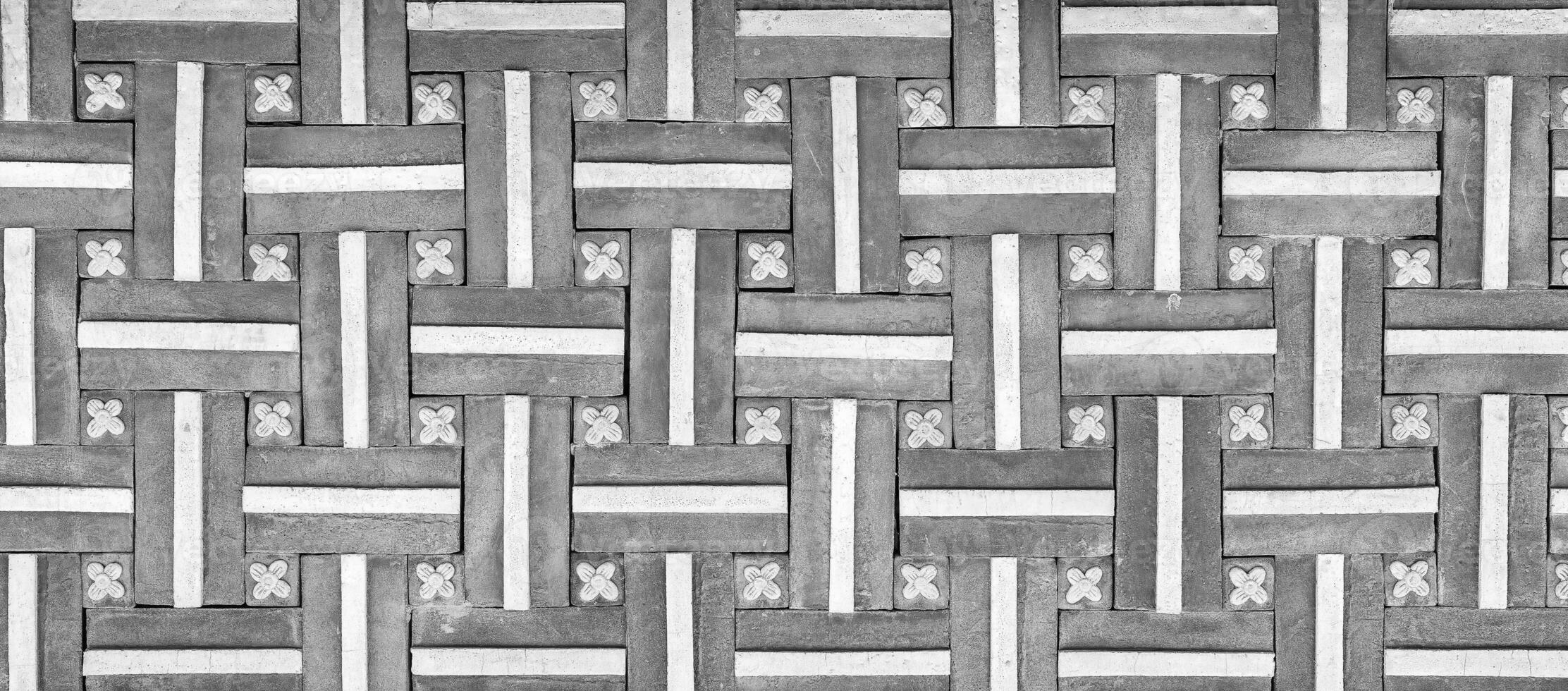 Black and white Texture of a decorative brick-like tiles. Abstract background for design. photo