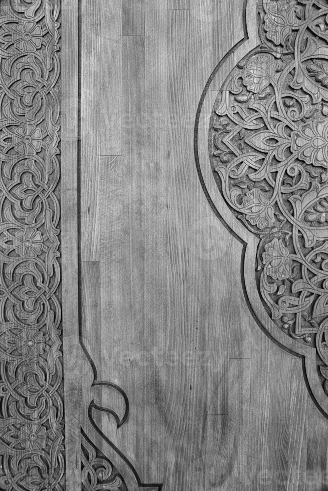 Black and white carved wooden doors with patterns and mosaics. 7 photo