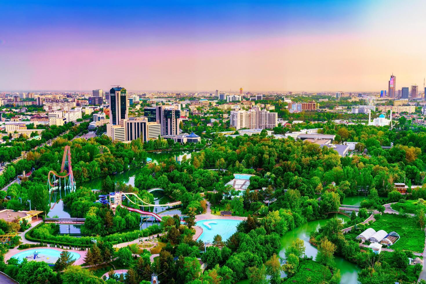 Uzbekistan, Tashkent - April 24, 2023 Top view from the observation deck on the Tashkent TV tower to the central part of the city during the twilight. photo