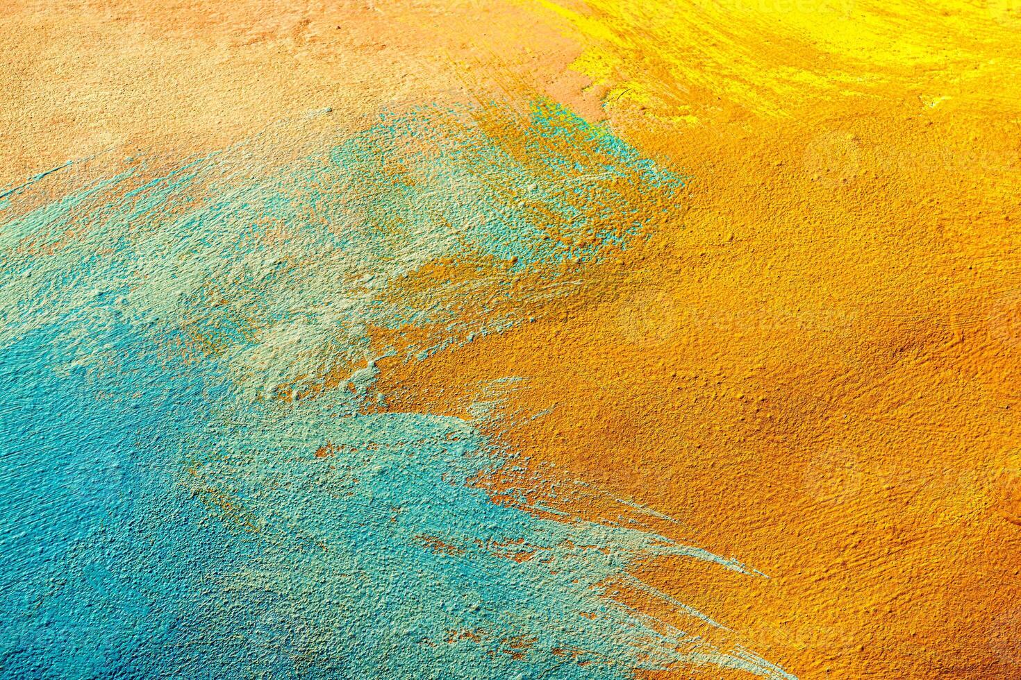 A fragment of colorful graffiti painted on a wall. Abstract urban background. Spray painting art. photo